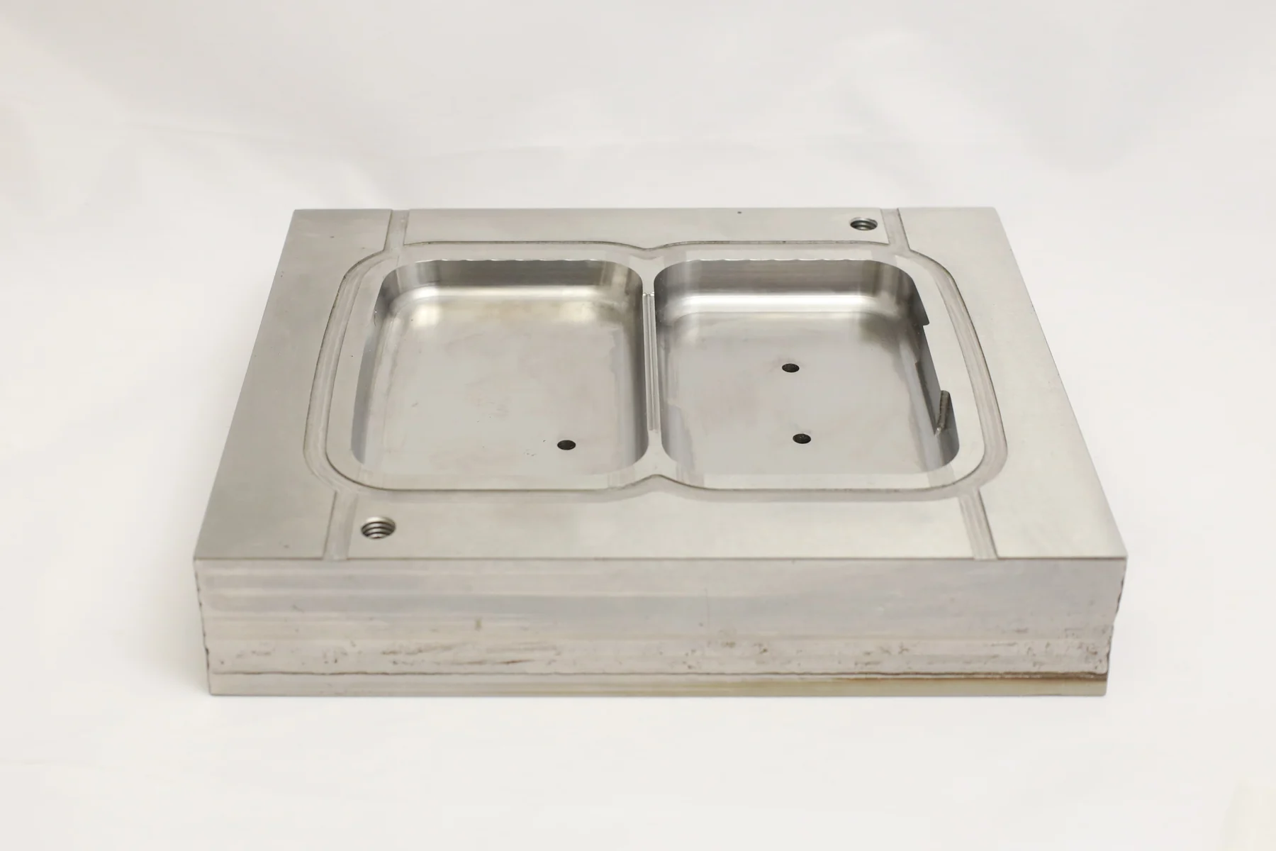 Conformal grid plastic injection mold with two machined cavities