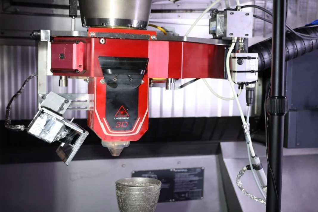 LT65 setup with laser deposition head and monitoring instrumentation